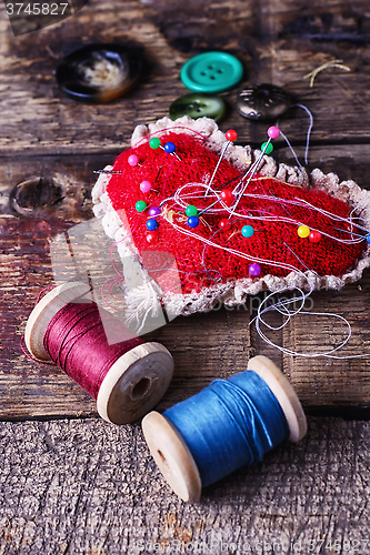 Image of pin cushion with needles