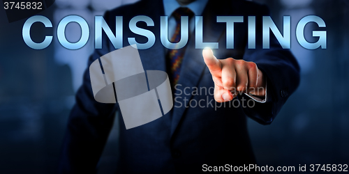 Image of Management Consultant Pushing CONSULTING Onscreen