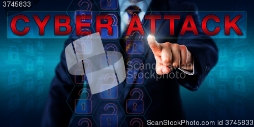 Image of Hacker Touching The Warning CYBER ATTACK Onscreen