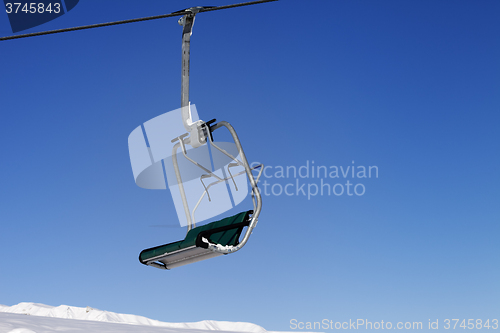 Image of Chair-lift and blue sky
