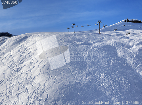 Image of Sunlight off-piste slope at morning