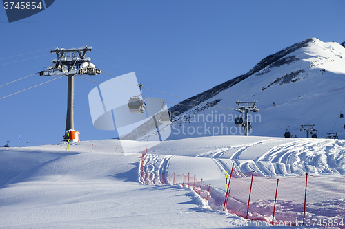 Image of Gondola lift on ski resort at sun day