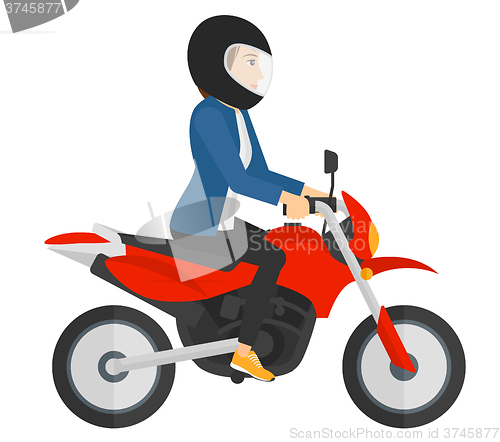 Image of Woman riding motorcycle.