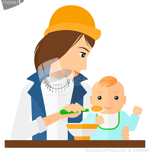 Image of Woman feeding baby.