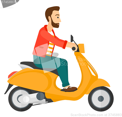 Image of Man riding scooter.