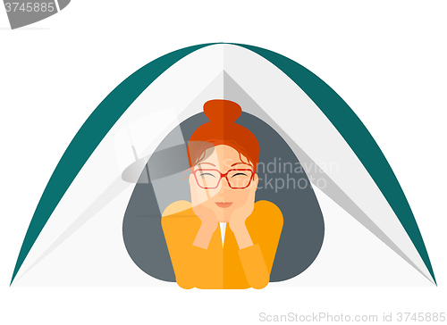 Image of Woman lying in tent.