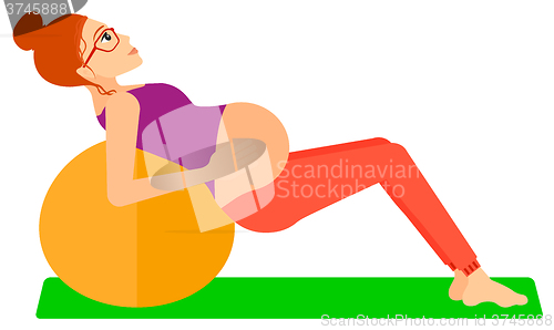 Image of Pregnant woman on gymnastic ball.