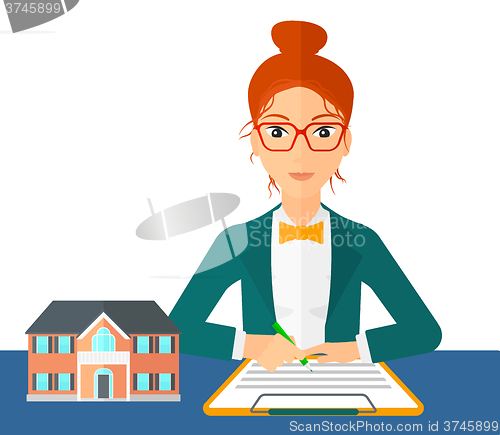 Image of Real estate agent signing contract.