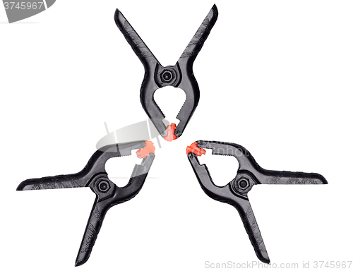 Image of Plastic black-orange clamps on white