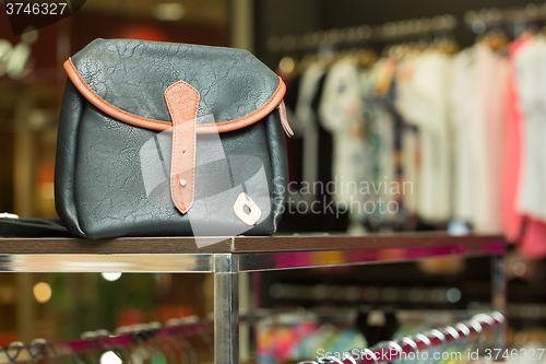 Image of blue bag on a shelf in the store