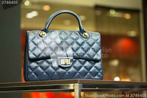 Image of blue bag on a shelf in the store