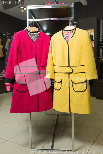 Image of clothes rack with ladies coats for sale