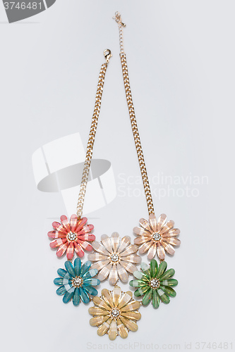 Image of metal feminine necklace. in the form of flowers