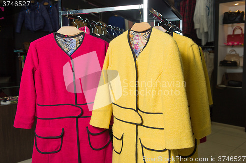 Image of clothes rack with ladies coats for sale