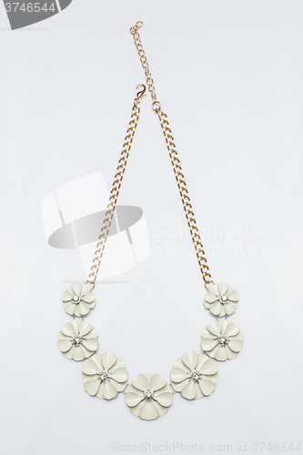 Image of metal feminine necklace. in the form of flowers