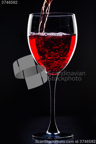 Image of Red wine pouring