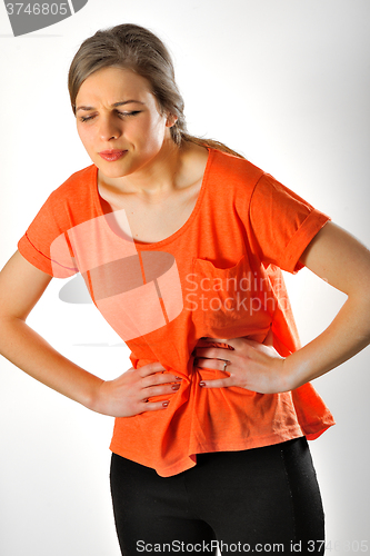 Image of Woman having abdominal pain