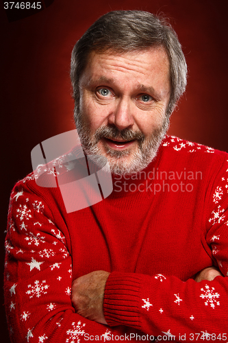 Image of Elderly  smiling man on a red background