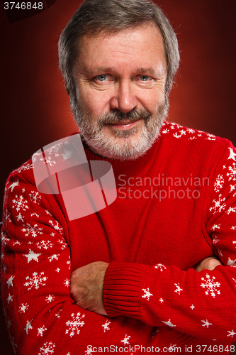 Image of Elderly  smiling man on a red background