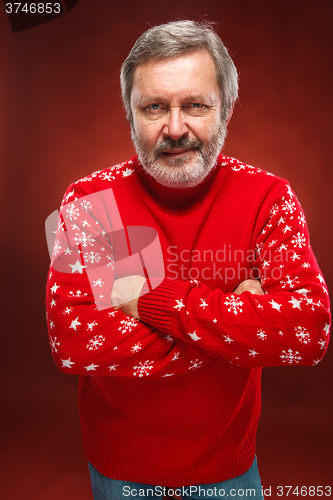 Image of Elderly  smiling man on a red background