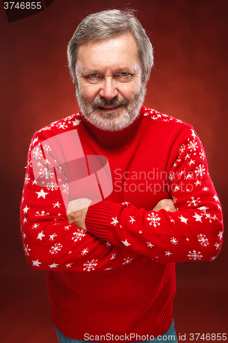 Image of Elderly  smiling man on a red background