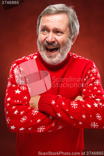 Image of Elderly  smiling man on a red background