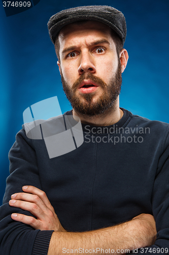 Image of The portrait of a young beautiful surprised man 