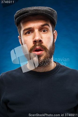 Image of The portrait of a young beautiful surprised man 