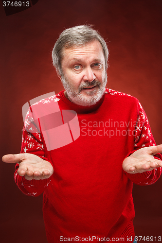 Image of Elderly  smiling man on a red background