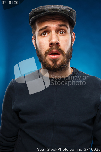 Image of The portrait of a young beautiful surprised man 