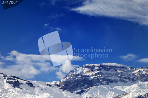 Image of Rocks in snow at nice sun day