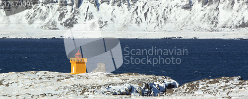 Image of Wide shot panorama of an orange lighthouse, Iceland