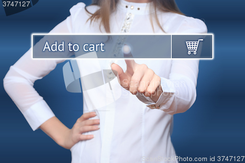 Image of Businesswoman pressing add to cart button on virtual screens. 