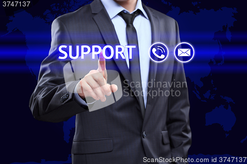 Image of business, technology, networking concept - businessman pressing support button on virtual screens