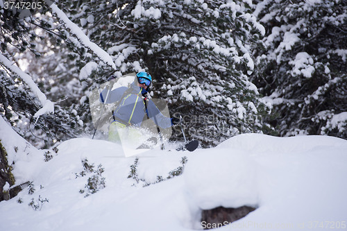 Image of freeride skier skiing in deep powder snow