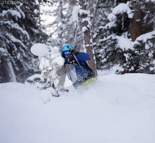 Image of freeride skier skiing in deep powder snow