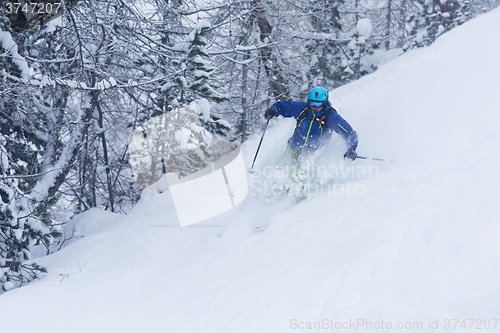 Image of freeride skier skiing in deep powder snow