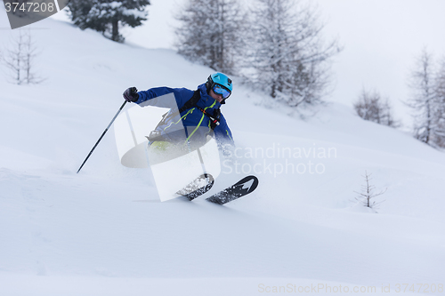 Image of freeride skier skiing in deep powder snow