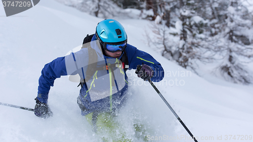 Image of freeride skier skiing in deep powder snow