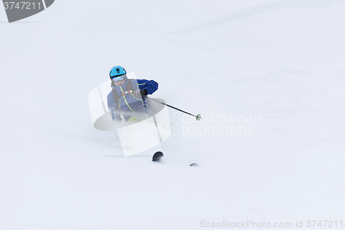 Image of freeride skier skiing in deep powder snow