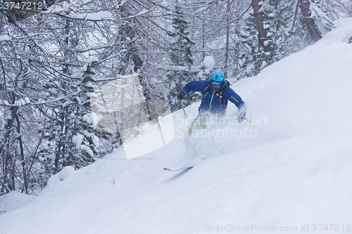 Image of freeride skier skiing in deep powder snow