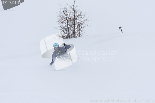 Image of freeride skier skiing in deep powder snow