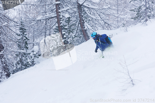 Image of freeride skier skiing in deep powder snow