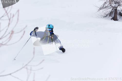 Image of freeride skier skiing in deep powder snow