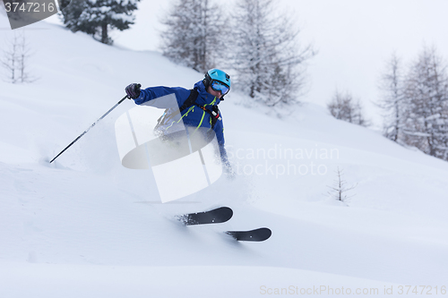 Image of freeride skier skiing in deep powder snow