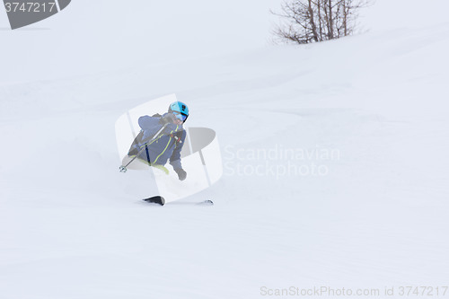 Image of freeride skier skiing in deep powder snow