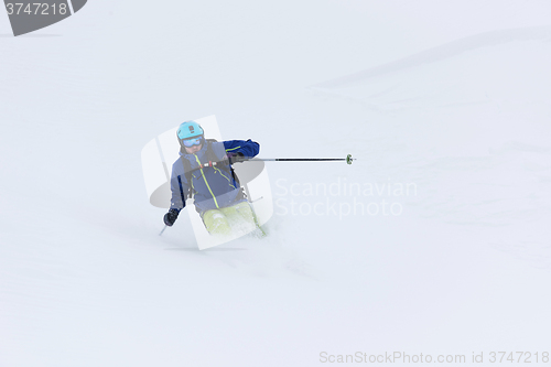 Image of freeride skier skiing in deep powder snow