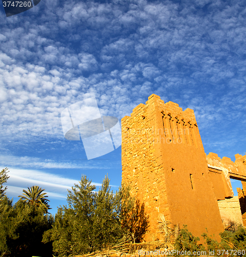 Image of africa  in histoycal maroc  old construction  and the blue cloud