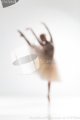 Image of Blurred silhouette of ballerina on white background