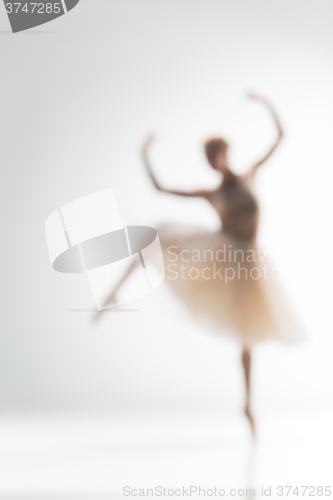 Image of Blurred silhouette of ballerina on white background